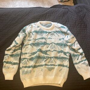 AREA sweater size XL, fits like over sized medium or large